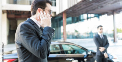 Bodyguard Getting Information About Arrival Of Boss