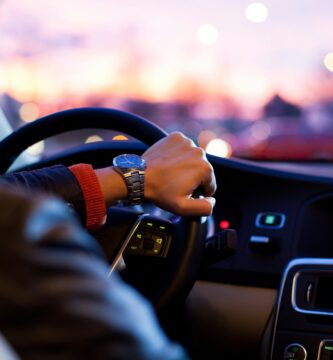 Hand on steering wheel